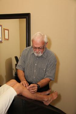 Doug working on knee of patient